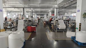 Automated production line of an industrial filter bag manufacturer ensuring dimensional precision