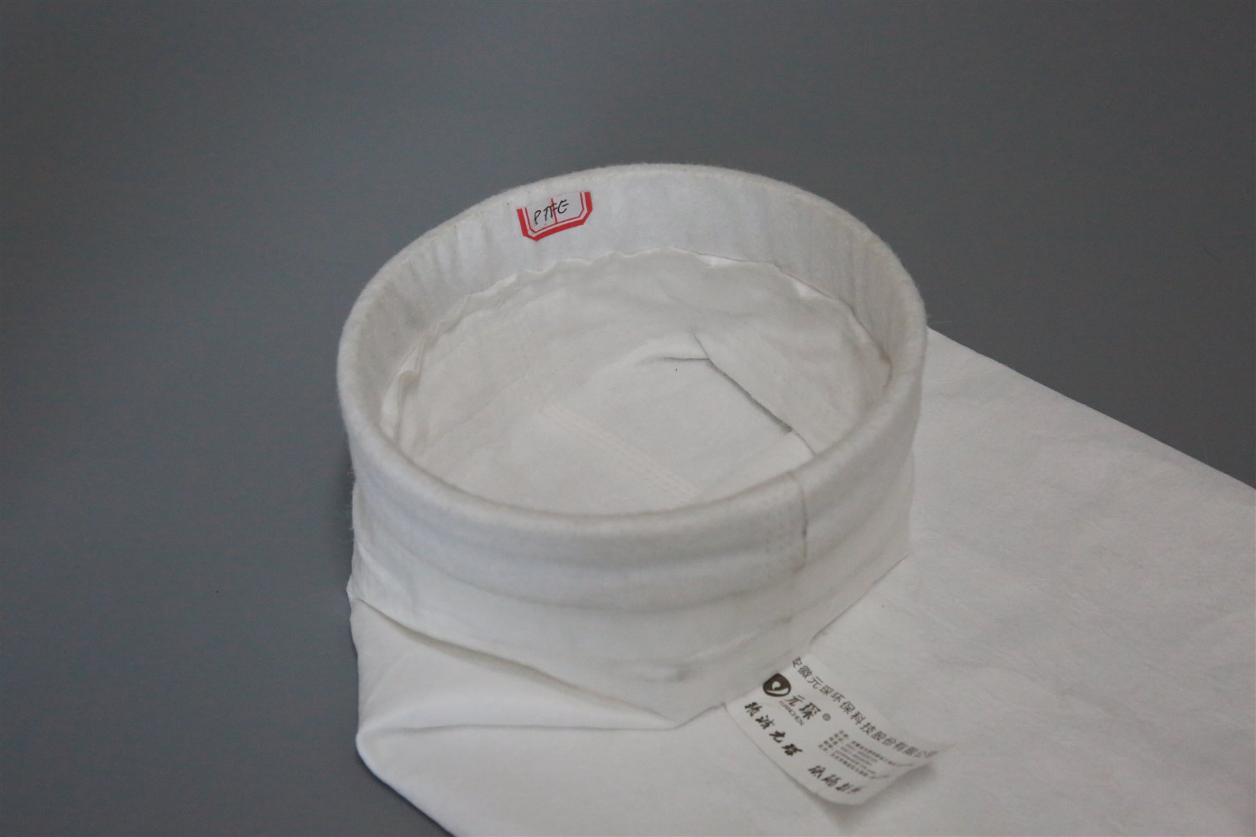PTFE filter bag cuff and seam construction detail