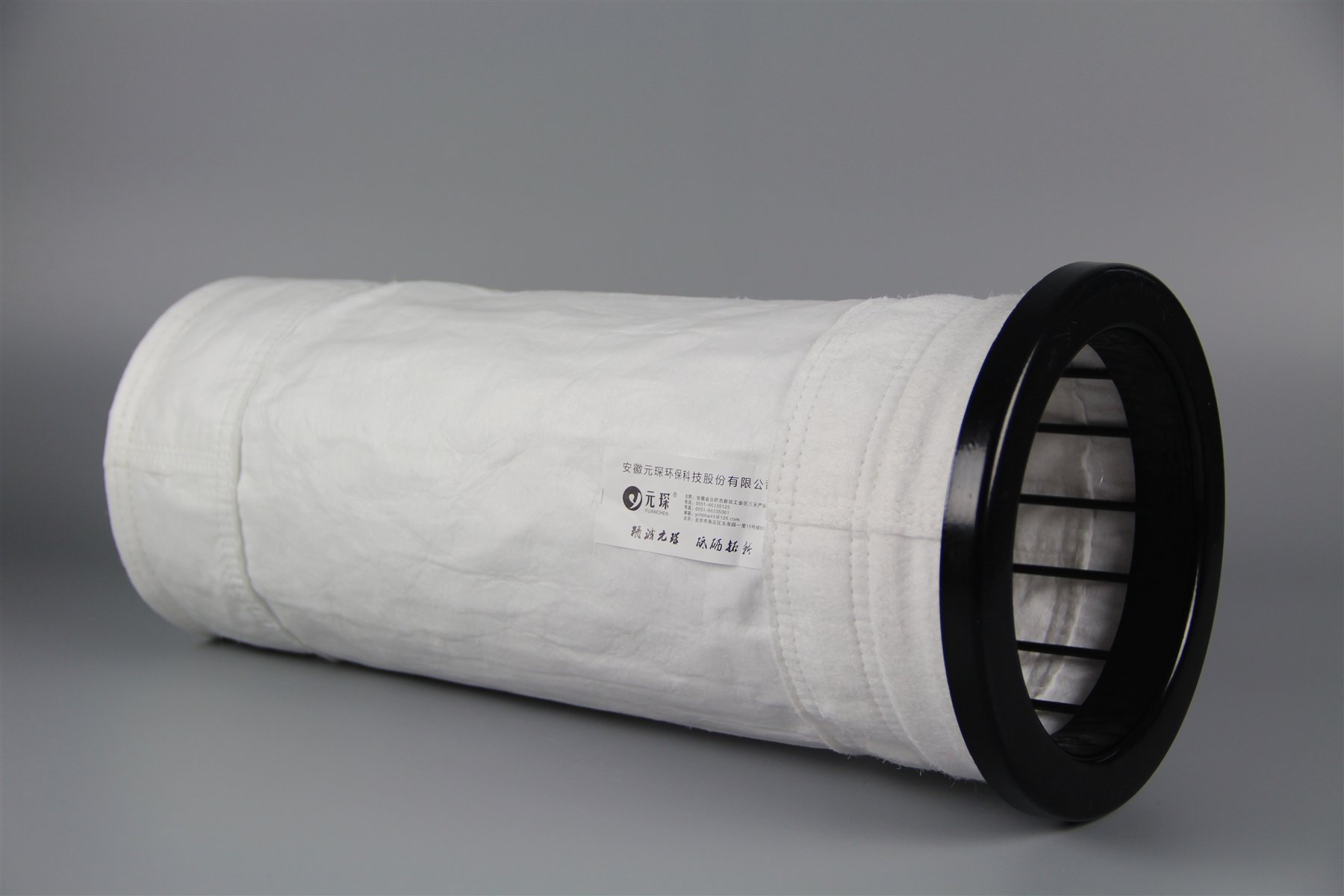 YuanChen PTFE filter bag fitted over a support cage