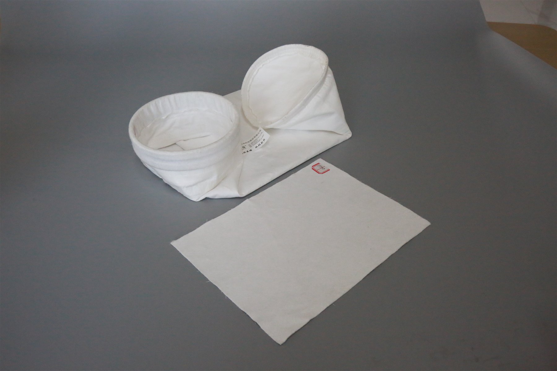 YuanChen PTFE filter bags with a PTFE media sample